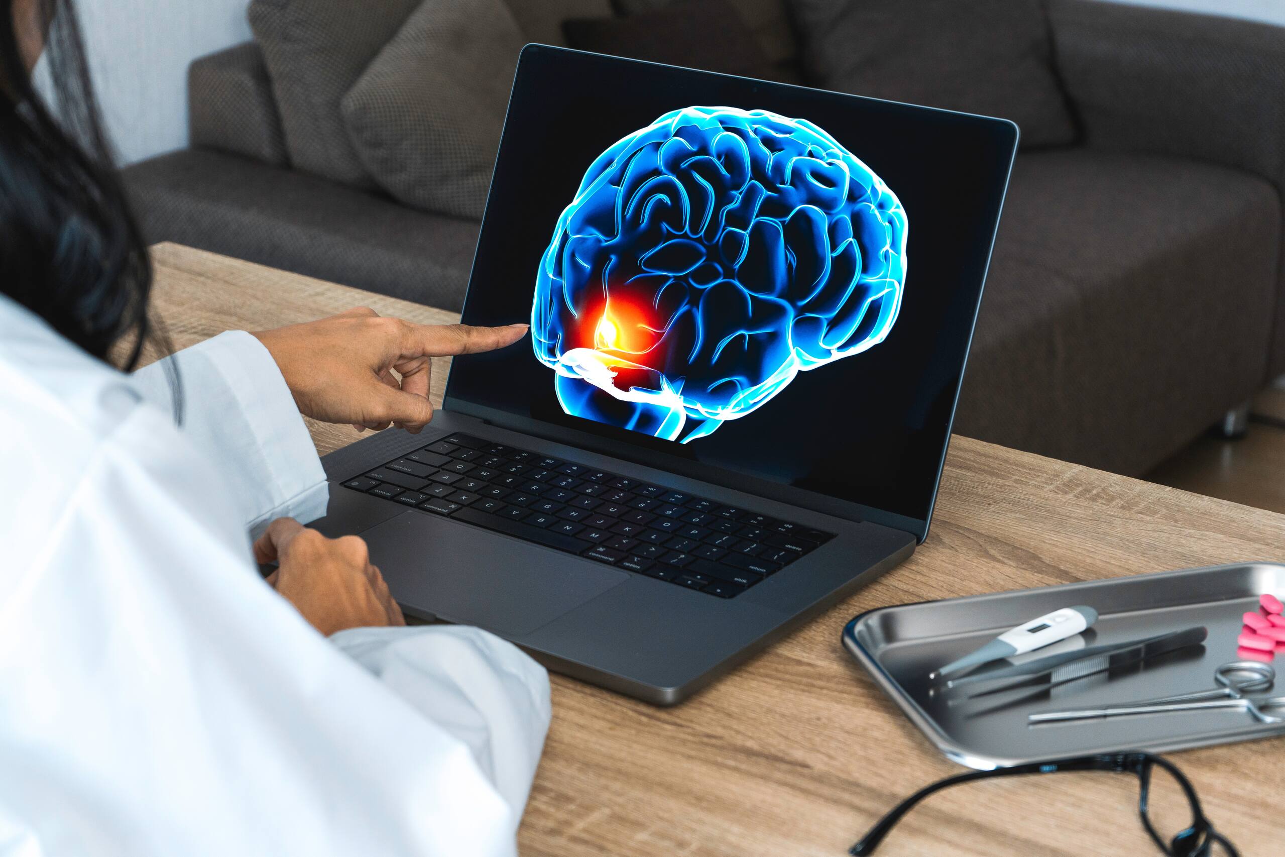 Doctor showing examples traumatic brain injury in Spokane on brain scan