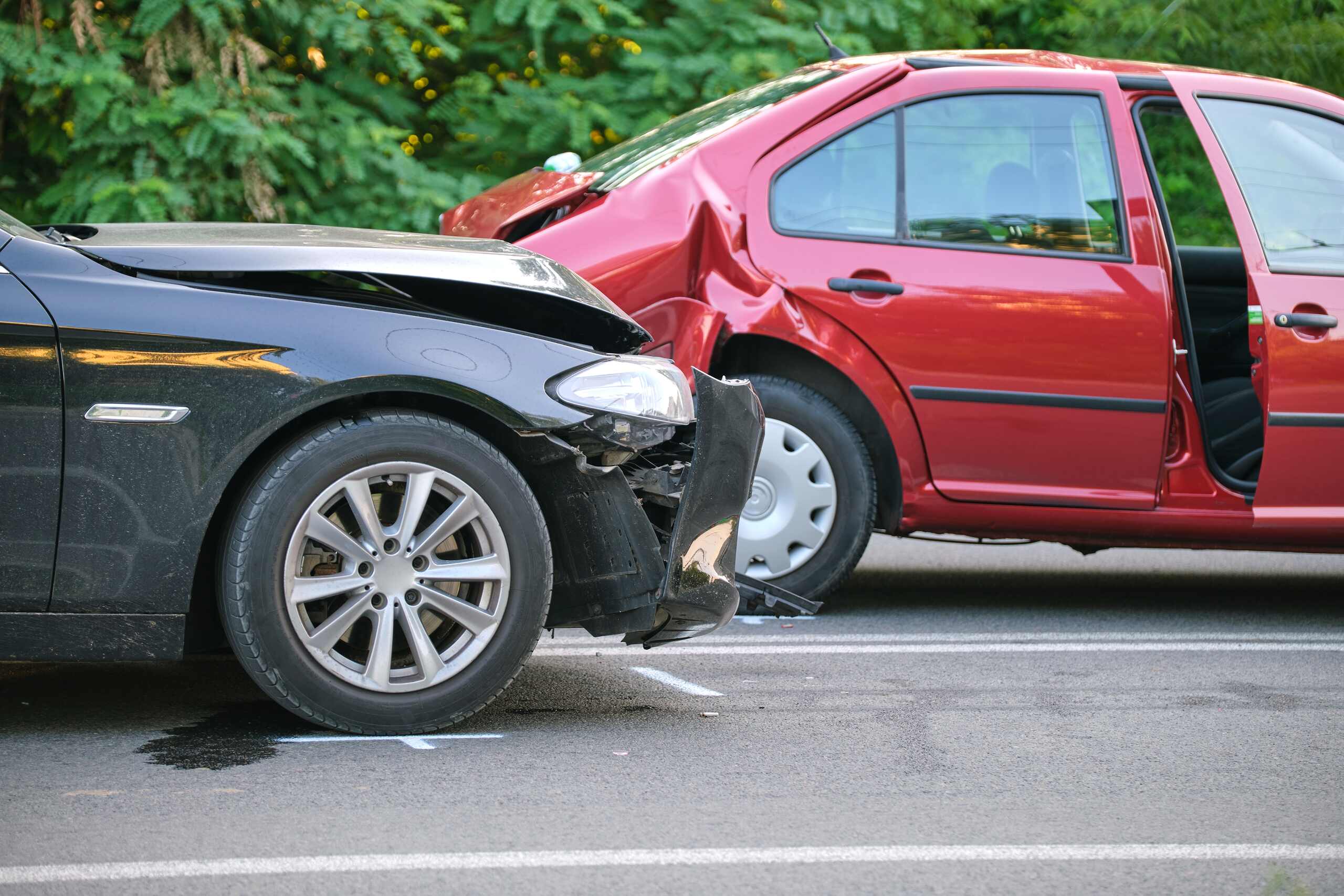 A silver car rear-ending a blue SUV in Spokane, where Washington’s pure comparative negligence laws allow for recovery despite the initial impact angle.