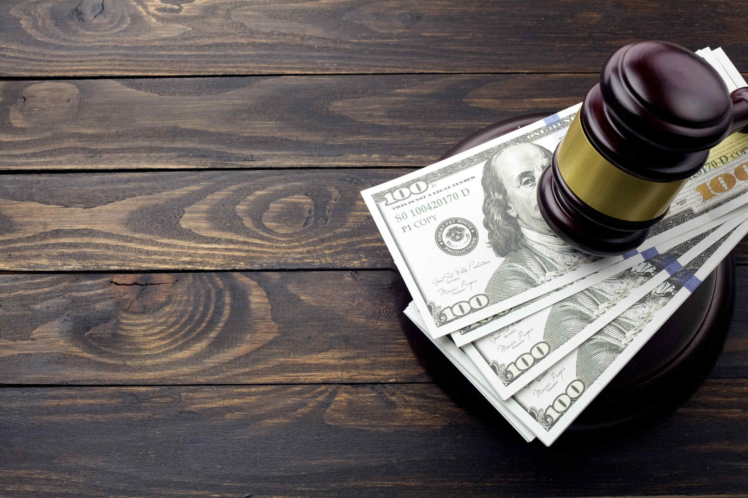 Legal gavel on cash representing The Demand Letter Strategy: Determining Your Maximum Settlement in Spokane personal injury claim