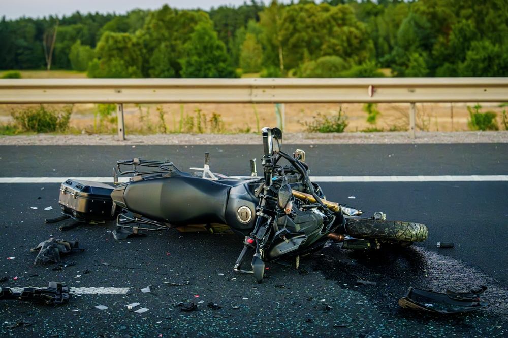 Motorcycle wreckage on Washington highway after a fatal crash caused by driver negligence
