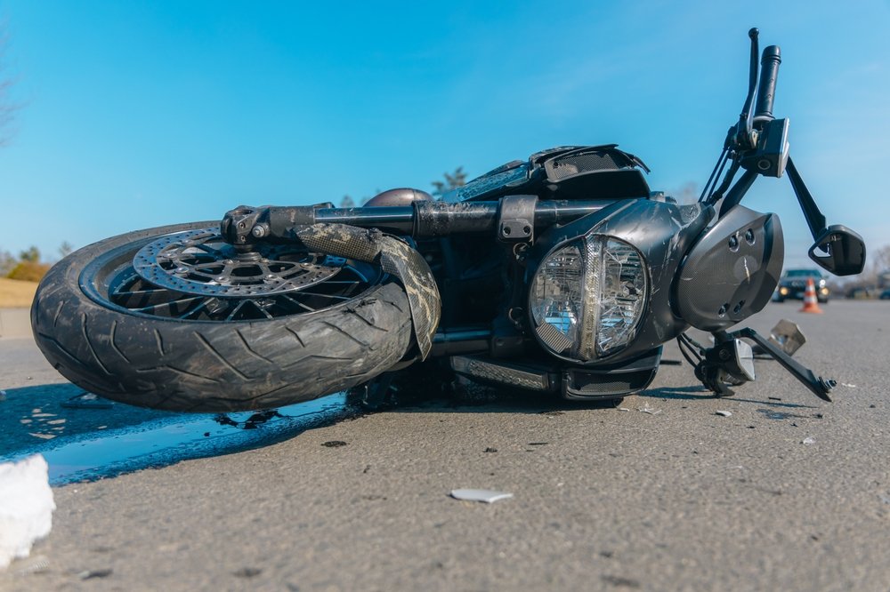 Close-up of a wrecked motorcycle's damaged front end after a Spokane-area collision