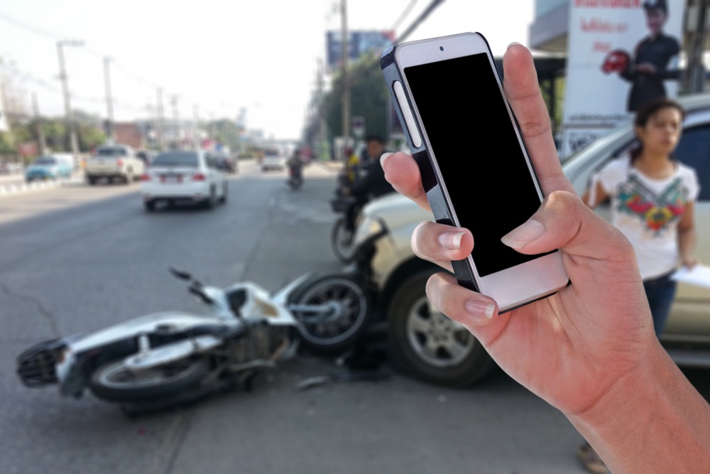 Bystander photographing a motorcycle crash scene, evidence insurers often dismiss under assumption of risk claims